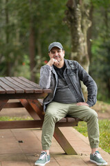 Obraz premium Confident middle-aged man portrait outdoors in natural light