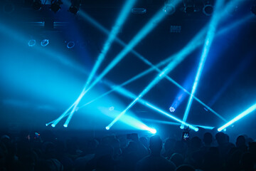 Nightclub stage lighting with a crowd