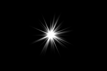 A bright starburst effect radiating light against a dark background.