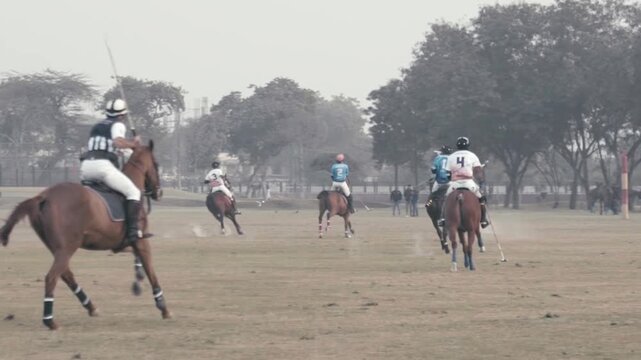 Horse Polo match. Men on horses playing polo.
