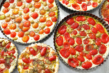 Baking tomato and olive focaccias ready for cooking