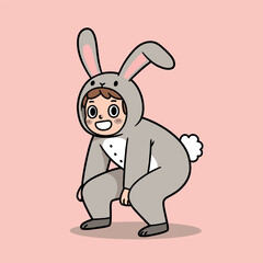 Cheerful person in gray bunny costume crouching playfully with big ears and fluffy tail, on pink background.