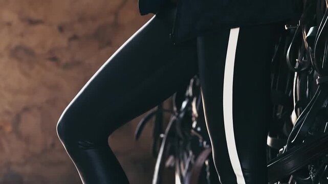 Stylise shot of women posing in tight black pants.