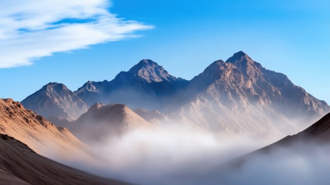 Desert mountain range blurred by swirling dust clouds under intense sunlight, dramatic natural forces