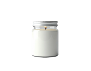A lit, white candle in a clear jar with a silver lid, isolated against black