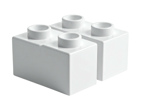 A close-up of a white, four-stud, interlocking toy building block