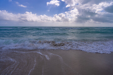 Wave motion on sea shore. Summer ocean breeze. Sea nature backdrop. Peaceful ocean. Dreamy ocean horizon. Coastal ocean paradise wallpaper. Seafoam waves. Azure water surface. Golden hour beach.