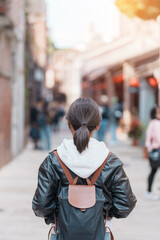 woman traveler visiting in Taiwan, Tourist with backpack sightseeing at Bopiliao Historic Block, landmark and popular attractions in Taipei city. Asia Travel and vacation concept
