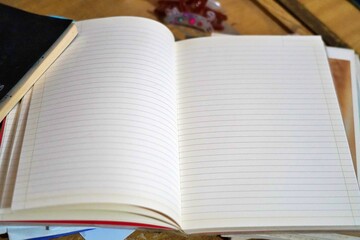Blank notebook page open on a study desk, ready for writing, planning, or creative ideas