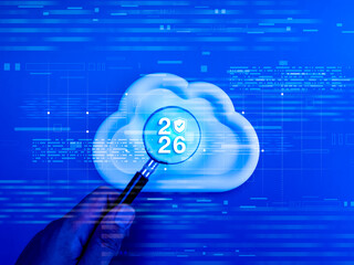 Cloud computing security 2026 concept with magnifying glass on cloud icon and shield symbol over digital blue background. Cloud storage technology, data protection, cybersecurity and future IT trends.
