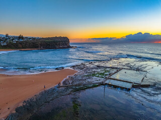 Sunrise at the beach with low cloud bank