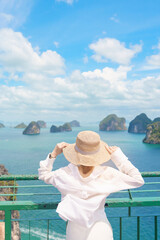 Fototapeta premium Woman tourist traveling in Krabi, Thailand. happy traveller enjoy and sightseeing view at koh Hong island viewpoint. summer trip, destination, Southeast Asia Travel, vacation and holiday concept