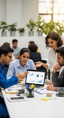 Indian team analyzing charts in coworking office
