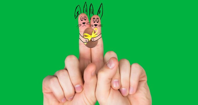 Easter bunnies holding easter eggs cartoons on index fingers against transparent background
