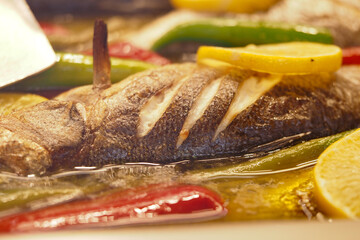 Grilled fish with lemon and vegetables for a tasty meal