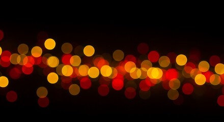 A shimmering band of out-of-focus golden, red, and orange lights creating a beautiful bokeh effect on a black background, ideal for festive designs and warm concepts