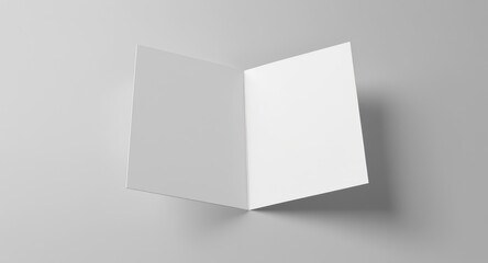 Open blank square card or booklet, top down, on plain background