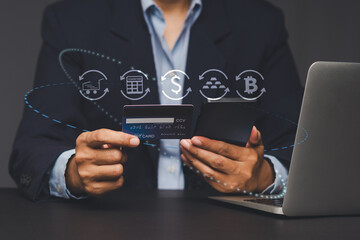 Businessman using credit card for online payment and digital transaction.