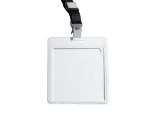 Blank white ID badge hanging from black lanyard on black