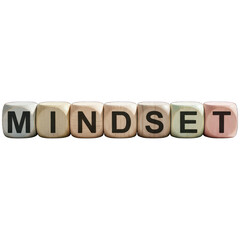 Dice spelling "MINDSET" against a black backdrop, highlighting focus and mental attitude