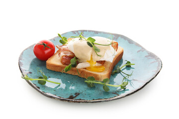 Plate of delicious egg Benedict with bacon and cherry tomato on white background