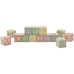 Wooden alphabet blocks spelling "NEW CHATTERS", arranged on a black background