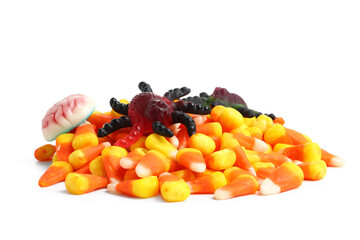 Heap of tasty Halloween candy corns, jelly spider and brain isolated on white background, closeup