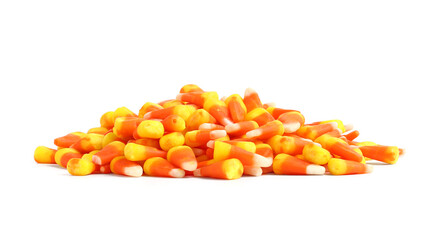 Heap of tasty Halloween candy corns isolated on white background, closeup