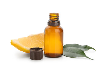 Bottle of essential lemon oil isolated on white background, closeup