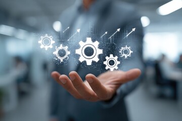Businessman displaying a holographic gears image
