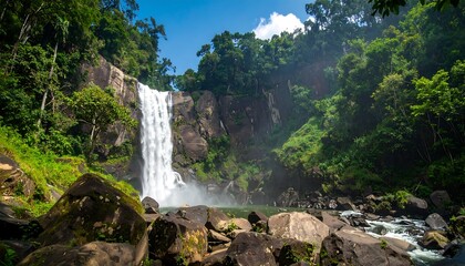 Lush waterfall cascading down rocky cliffs