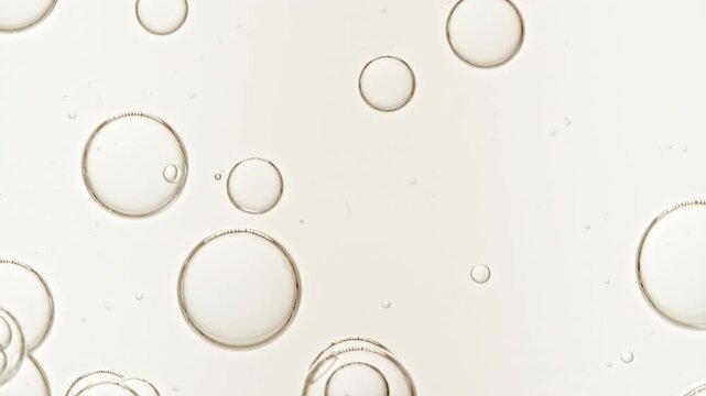 Macro Shot of Cosmetic Essence, Liquid bubble, Collagen fluid bubble molecule. Transparent Cosmetic Sample Texture With Bubbles. High quality 4k footage