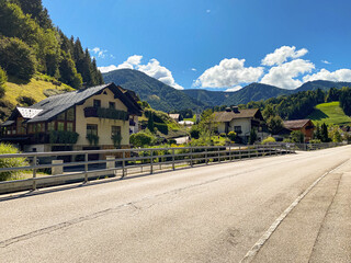 Traditional European Village with Charming Houses in Mountain Nature