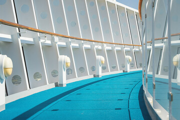 White with blue deck of cruise ship