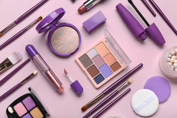 Composition with different cosmetic products and makeup brushes on lilac background, closeup
