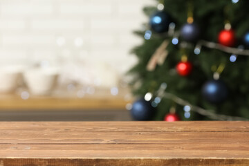 Empty wooden table in kitchen on Christmas eve