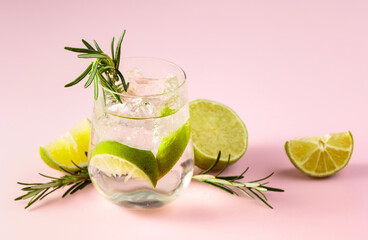 Summer refreshing drink with ice, lime and rosemary.
