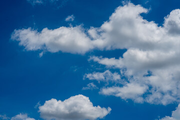Bright Blue Sky with White Fluffy Clouds