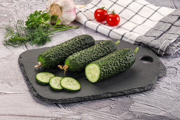 Raw green cucumbers with slices
