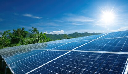Solar panels on a sunny day, with mountains and trees in the background