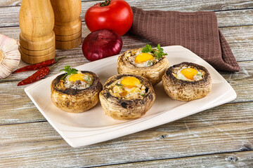 Baked champignon with quail egg