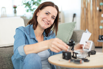 woman assembling an action camera