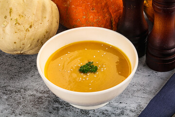 Vegan pumpkin cream soup served sesam