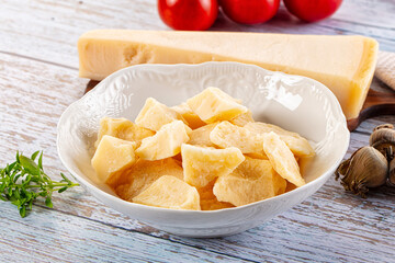 Parmesan cheese pieces in the bowl