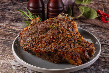 Baked beef steak on the bone