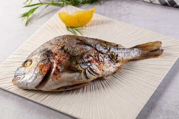 Baked dorada fish with spices