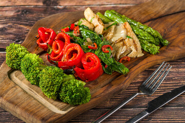 Grilled mixed vegetables with asparagus and peppers on wooden board