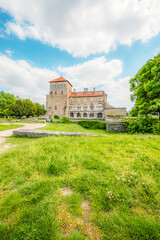 Old stone Tata Castle - 14th-century castle and museum with restored rooms and garden in Tata town, Hungary