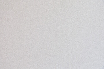 A white wall with a very rough texture