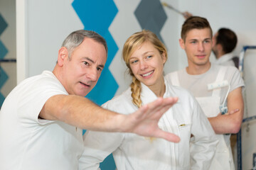 young apprentice painter in professional training